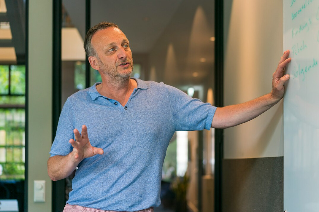 man gesturing during talk