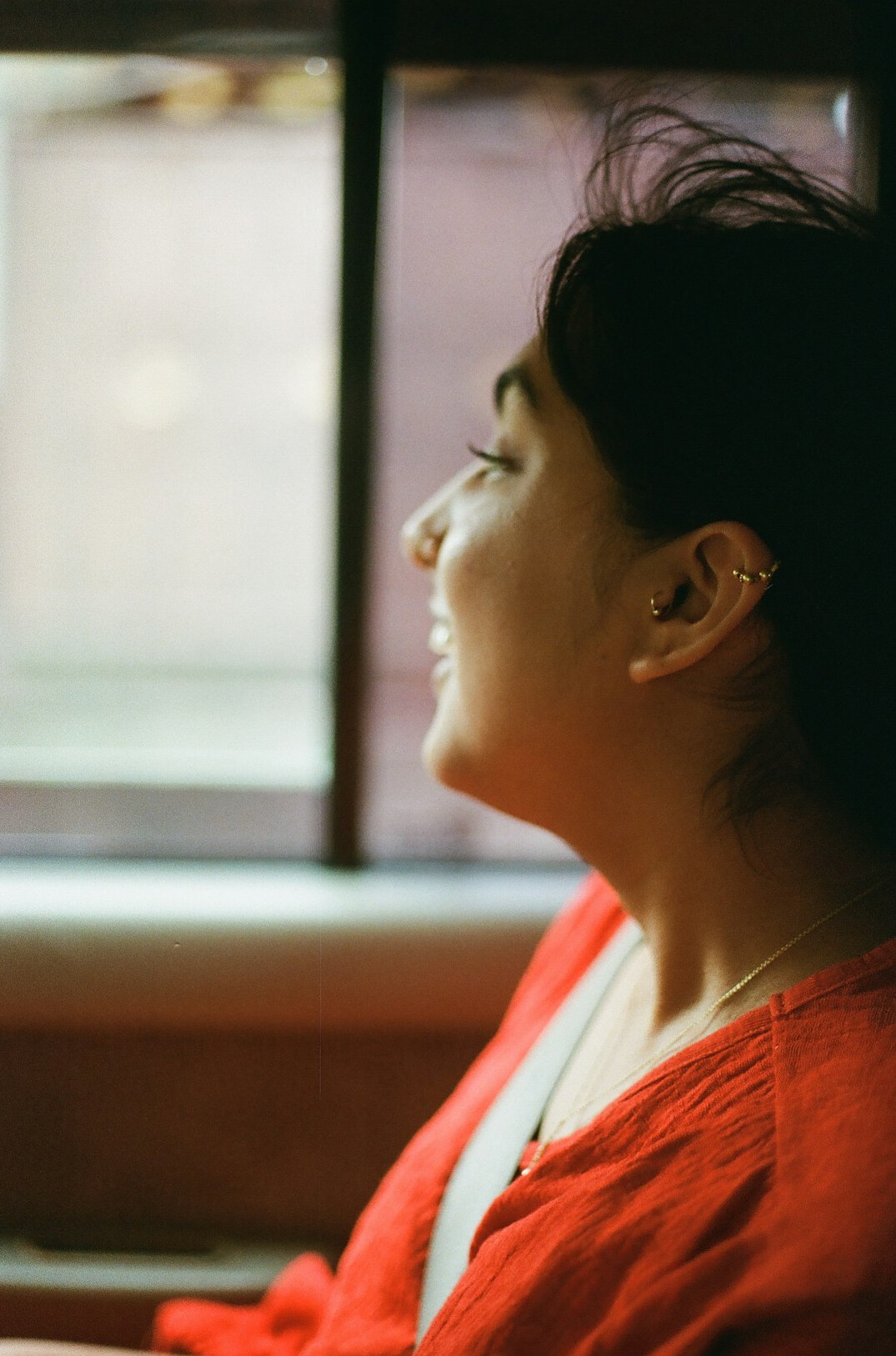 Person meditating quietly by a window